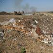 Fosta groapă de gunoi a comunei Moara fumegă aproape zilnic