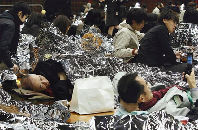 Circa 590.000 de persoane au fost evacuate în Japonia după cutremurul urmat de tsunami de vineri (foto: AP Photo/Kyodo News)