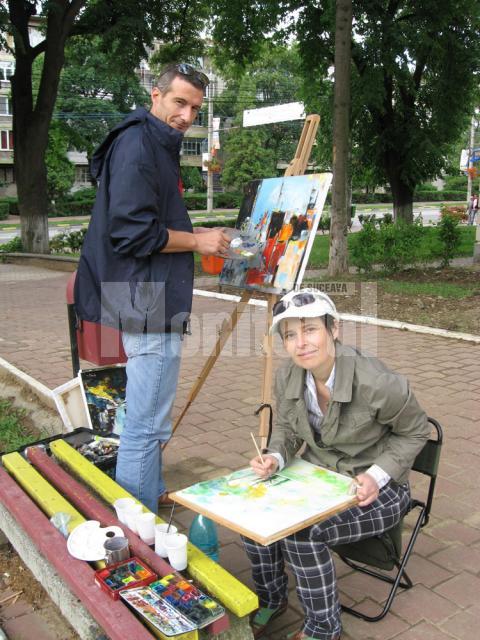Carmel Georgescu şi Ana Maria Ovadiuc, pictând în parc