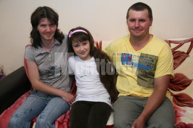 Corina şi Marius Hreniuc, împreună cu Valentina
