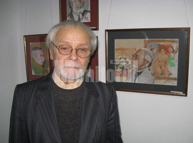 Adrian Bocancea lângă portretul realizat de Anton Costîn