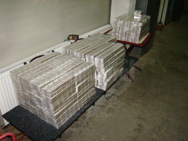 Aproape 4.000 de pachete de ţigări de contrabandă, găsite în pereţii unui microbuz