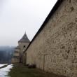 Turnul clopotniţă din zidul mănăstirii pe contrafortul căruia se află chipul Româncei