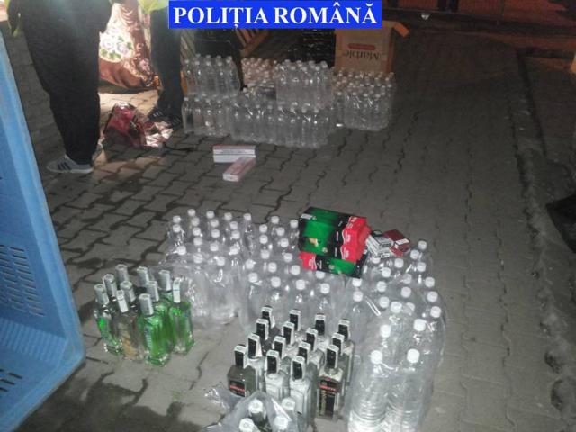 Aproape 2.000 de litri de alcool şi 900.000 de ţigări de contrabandă, confiscate la percheziţiile din zona Pieţei Mari