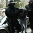 Alexandru Huțuleac, adus de mascaţii poliției în fața procurorului criminalist