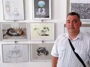 Caricaturistul Ovidiu Ambrozie Bortă BOA , organizator şi membru al juriului