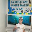 Iannis Matei Dumitrașcu a sărbătorit aniversarea de 10 ani în fața blocului, cu mascații poliției