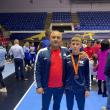Antrenorul Florin Rusu alaturi de sportivul Alexandru Lungu, învingător la Wrestling Challenge