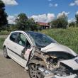 O familie cu trei copii a scăpat în ultima secundă din mașina lovită de tren