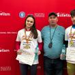 Antrenorul Cristian Prâsneac încadrat de cei doi campioni naționali