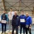 Antrenorul Iustin Tătărău, primul din dreapta, alături de atletul Marian Vasile Ignătescu